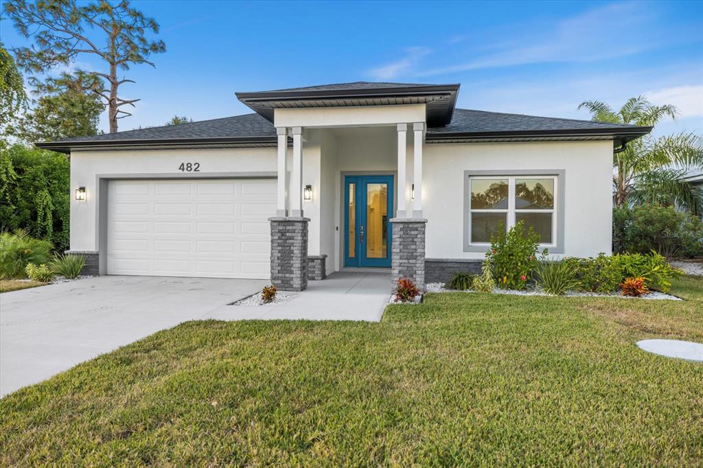 front view of a house with a yard