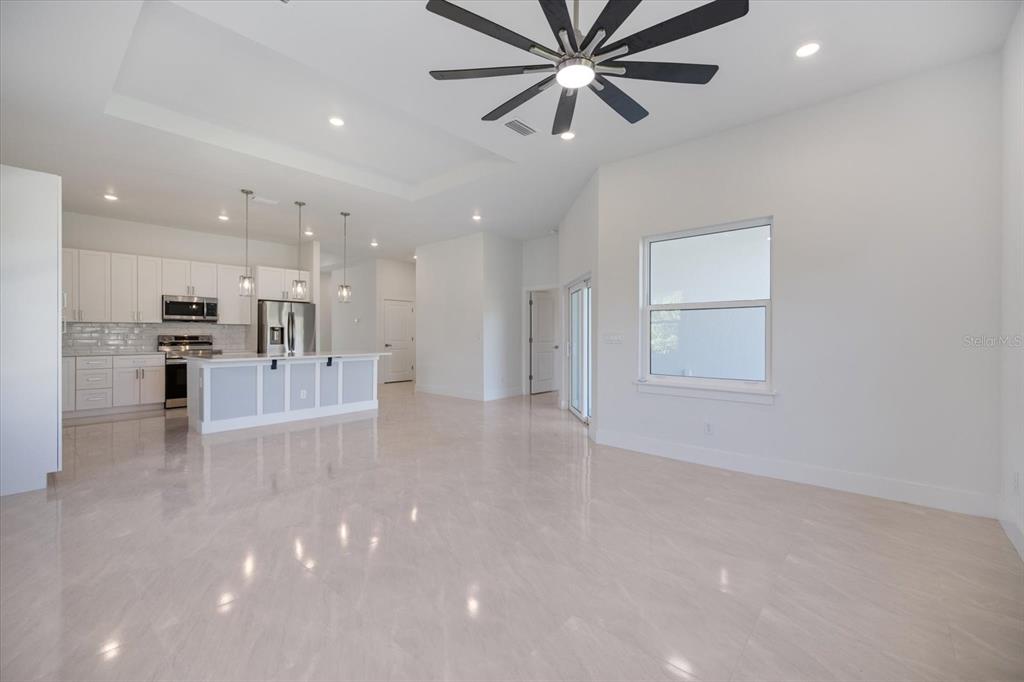 482 Sunset Road North Rotonda West, FL 33947 - Photo 13 of 45 a view of a kitchen with a sink stainless steel appliances and cabinets