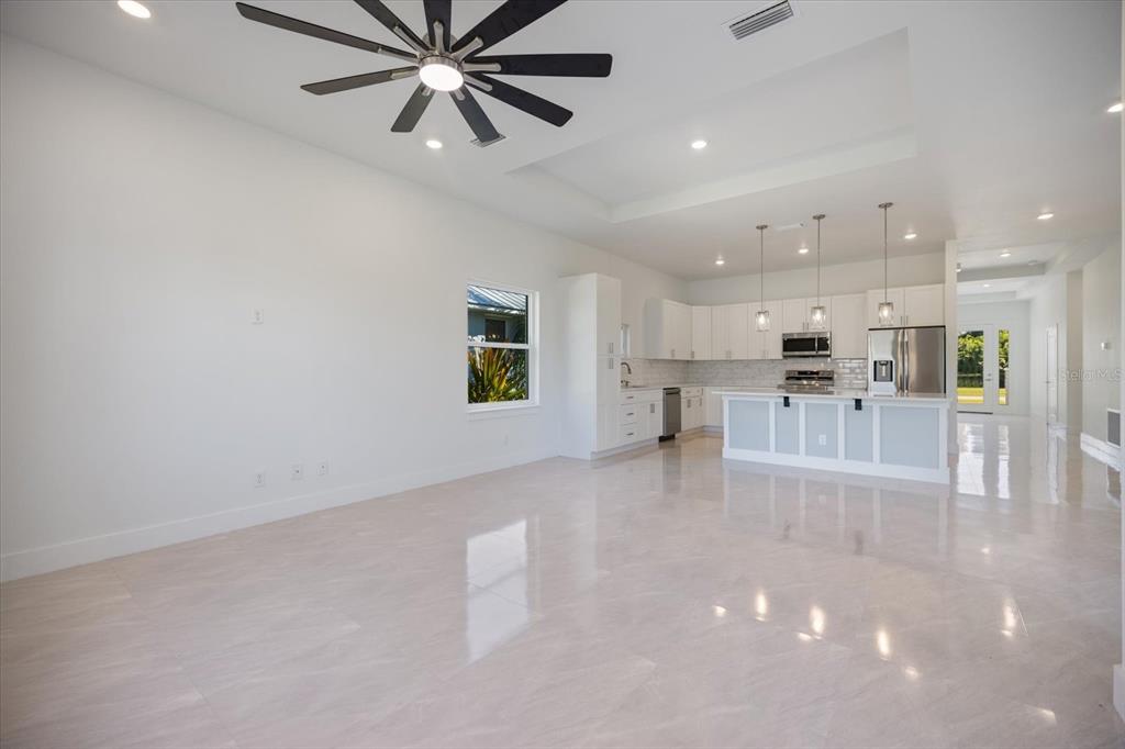 482 Sunset Road North Rotonda West, FL 33947 - Photo 14 of 45 a view of work space with wooden floor and windows