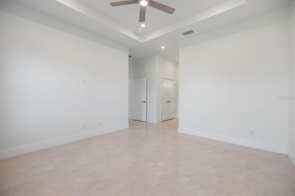 482 Sunset Road North Rotonda West, FL 33947 - Photo 23 of 45 wooden floor in an empty room