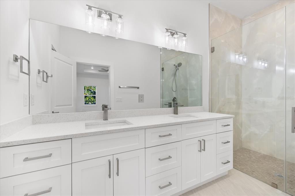 482 Sunset Road North Rotonda West, FL 33947 - Photo 27 of 45 a bathroom with a granite countertop sink mirror and double