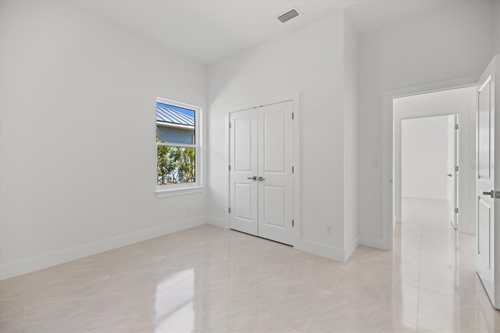 482 Sunset Road North Rotonda West, FL 33947 - Photo 29 of 45 an empty room with windows