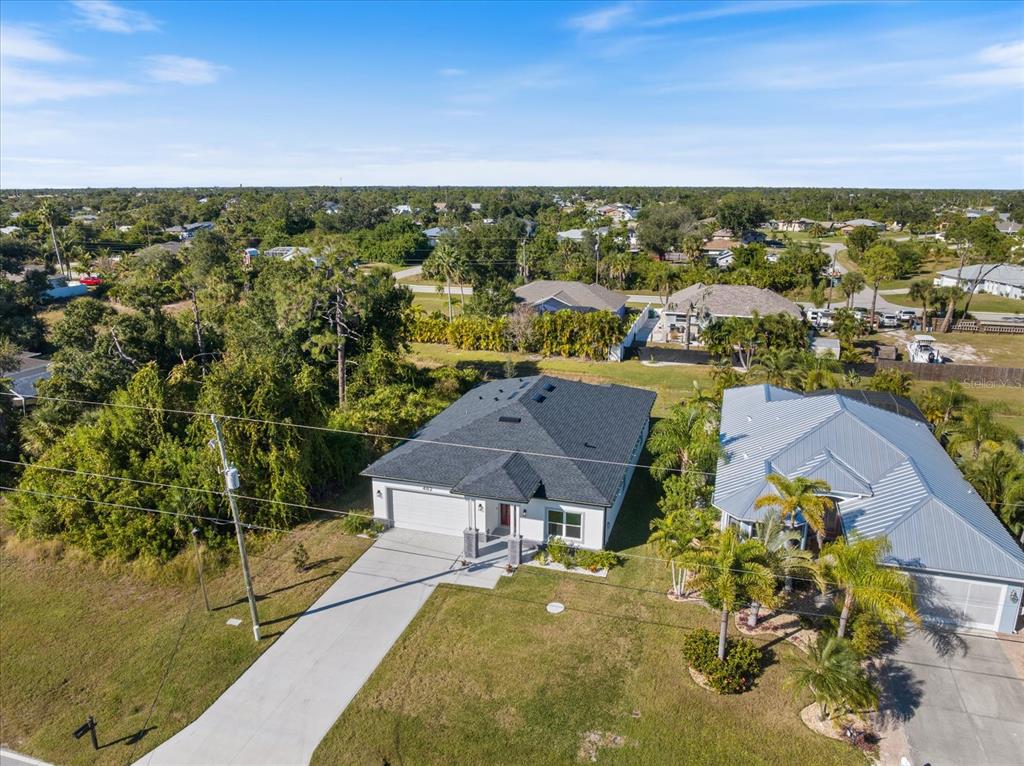 482 Sunset Road North Rotonda West, FL 33947 - Photo 39 of 45 an aerial view of residential houses with outdoor space