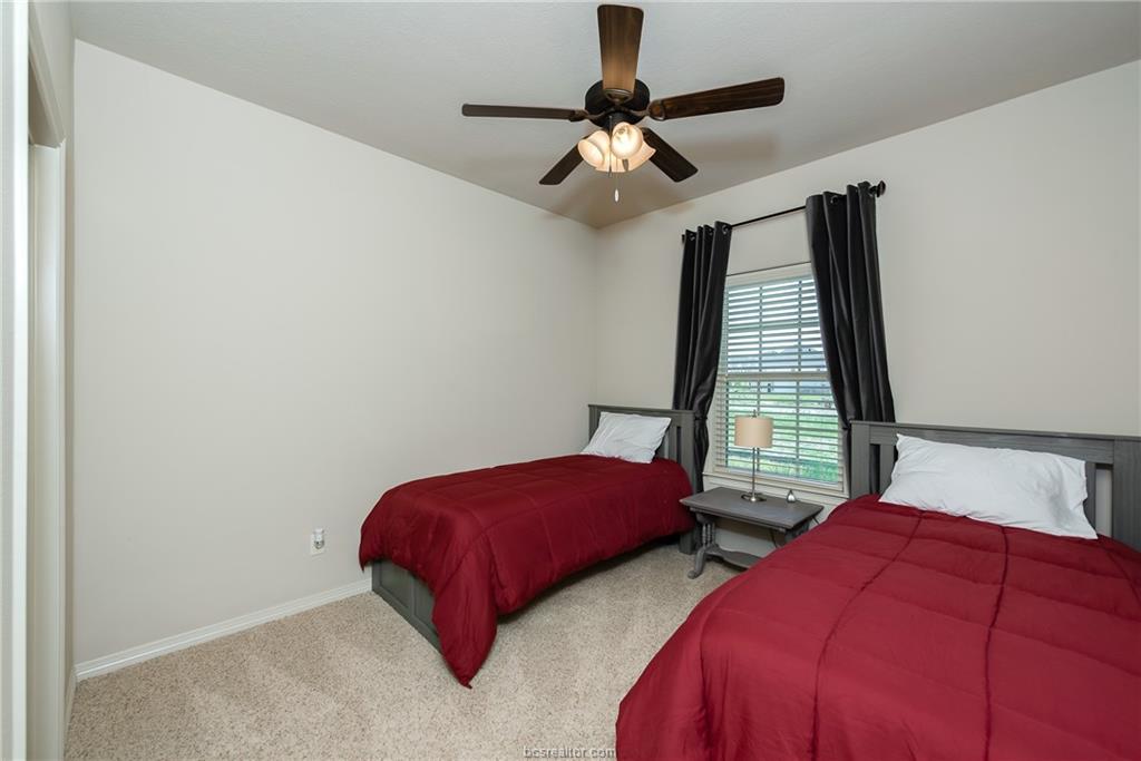 1408 Cres Ridge Drive College Station, TX 77845 - Photo 12 of 19 a bedroom with two beds and a window