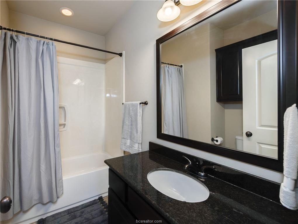 1408 Cres Ridge Drive College Station, TX 77845 - Photo 13 of 19 Bathroom 2 with vanity and shower / bath combo with shower curtain
