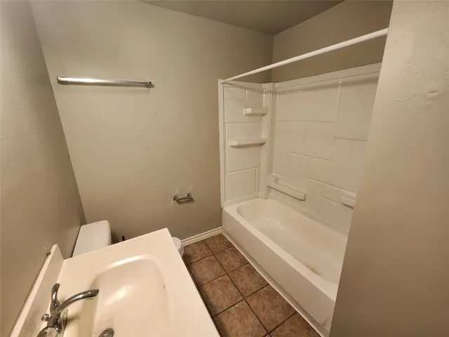 a bathroom with a sink and a shower