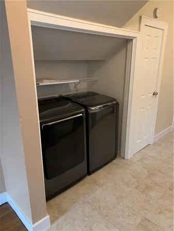 a view of a kitchen with cabinets