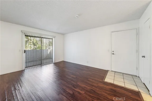 a view of a dining room with furniture and a chandelier fan