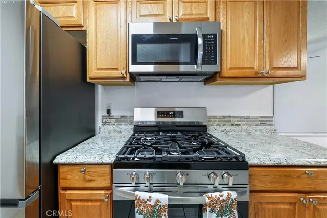 a kitchen with a stove and a microwave