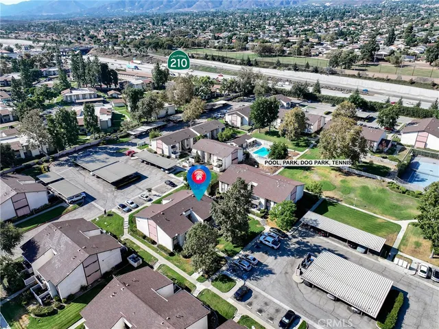 a front view of residential houses with yard