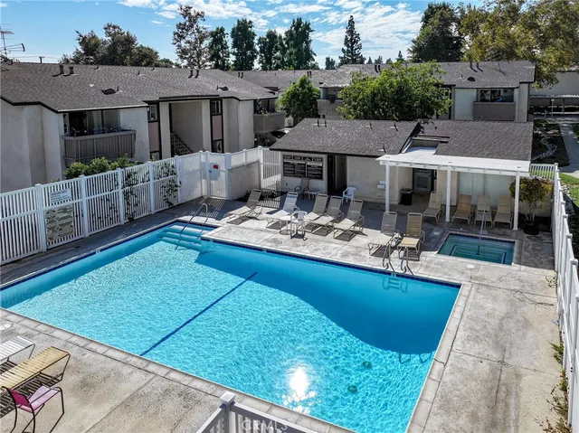 a front view of house with yard and outdoor seating