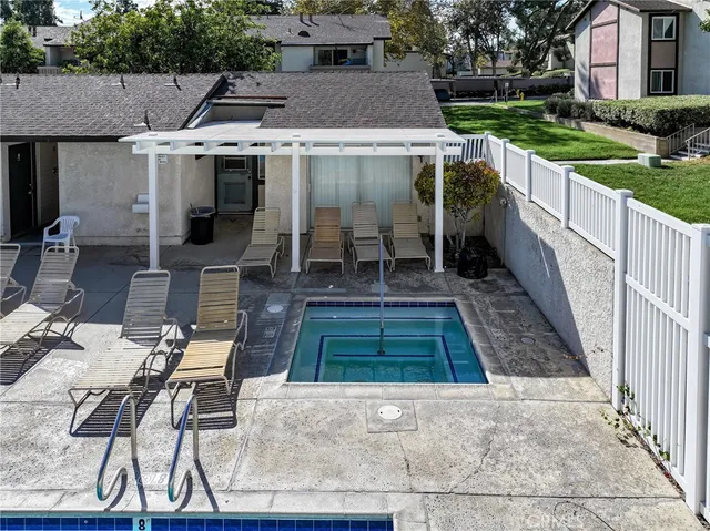 a backyard of a house with yard and outdoor seating