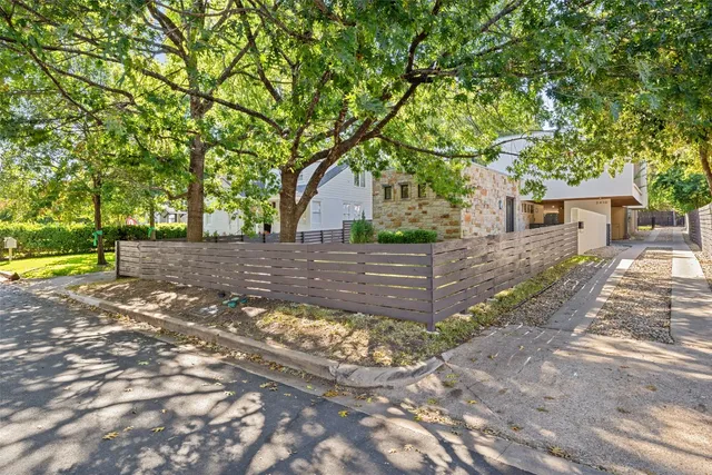 a view of yard with swimming pool and trees