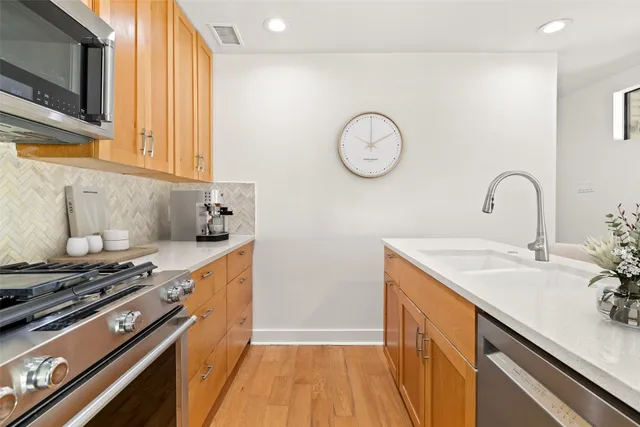 a bathroom with a sink vanity and a mirror