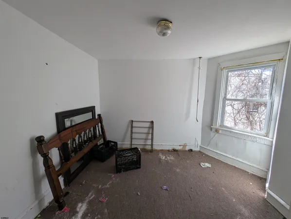 a room with furniture and a window