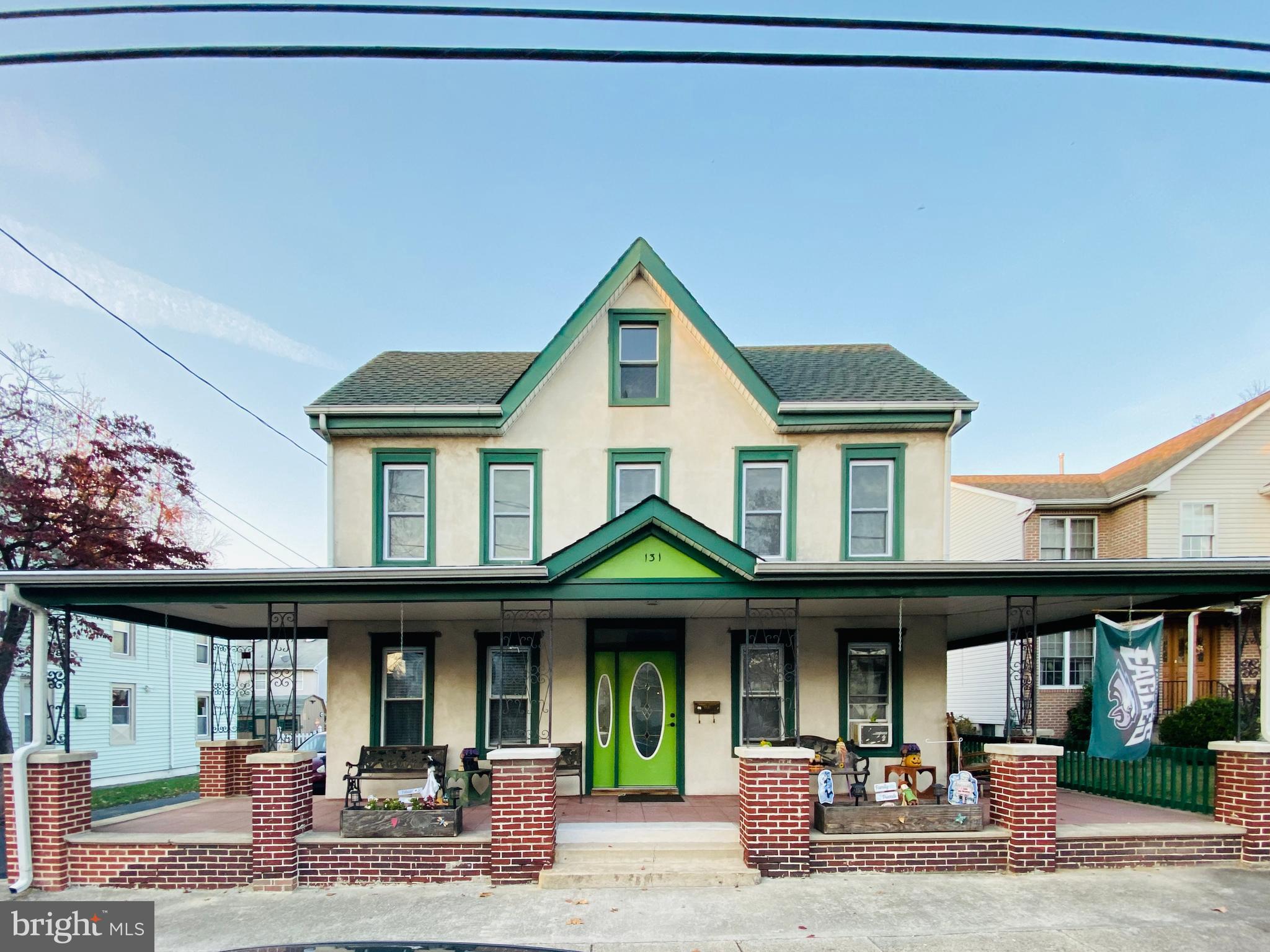Front of house w/wraparound porch
