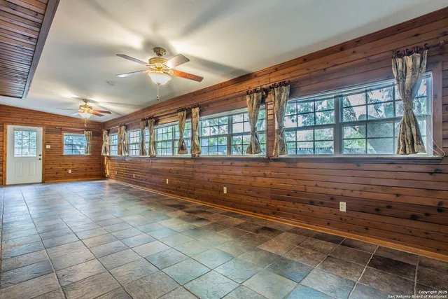 a view of room with window and ceiling fan