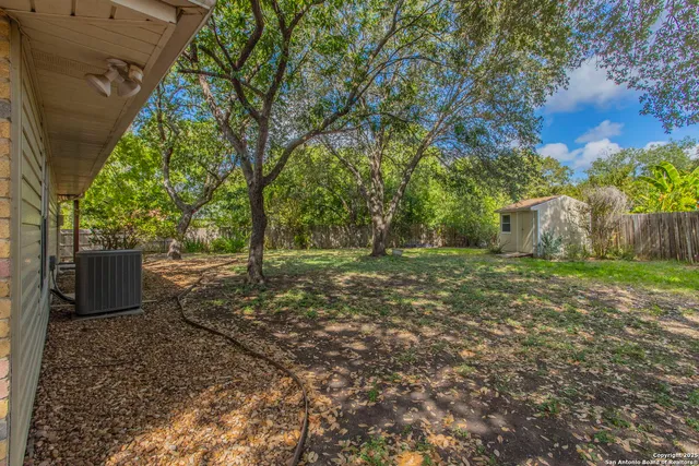 a big yard with trees