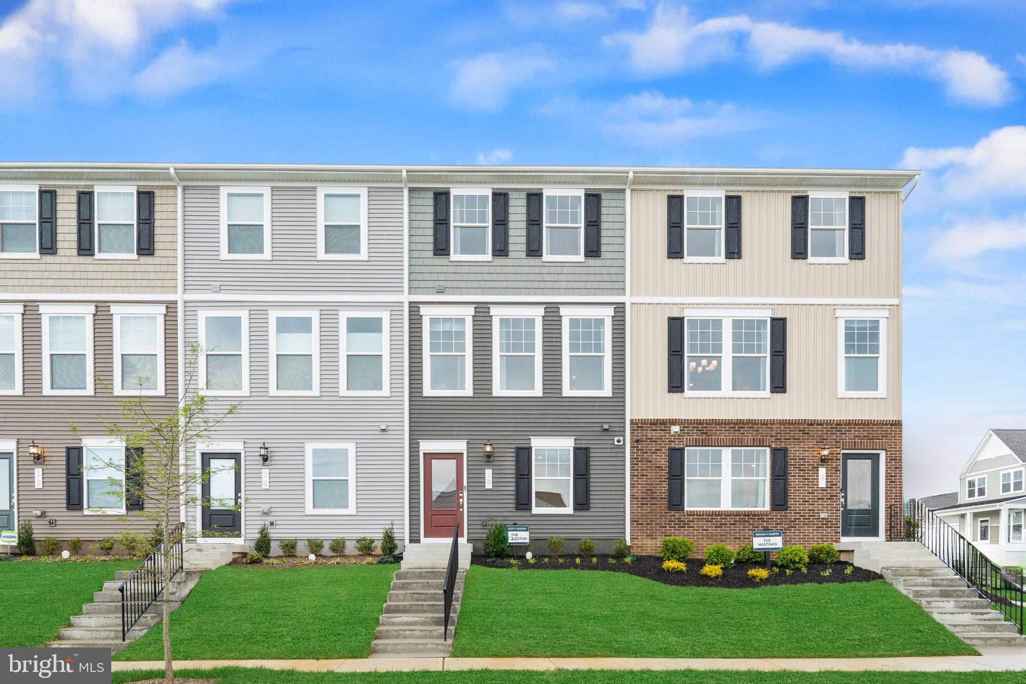 316 Presidents Pointe Avenue, Unit 613 Ranson, WV 25438 - Photo 44 of 87 a front view of a residential apartment building with a yard