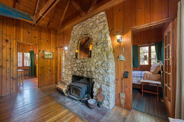 a bedroom with a large bed and a large window
