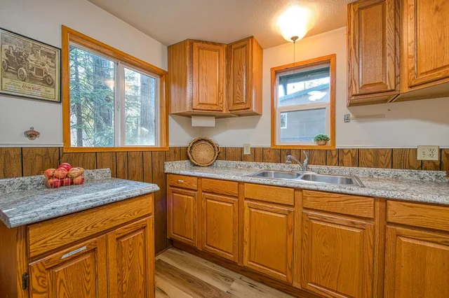 a view of a living room with furniture and wooden floor