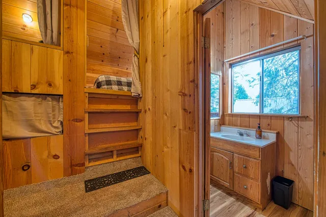 a bathroom with a sink a toilet and a shower