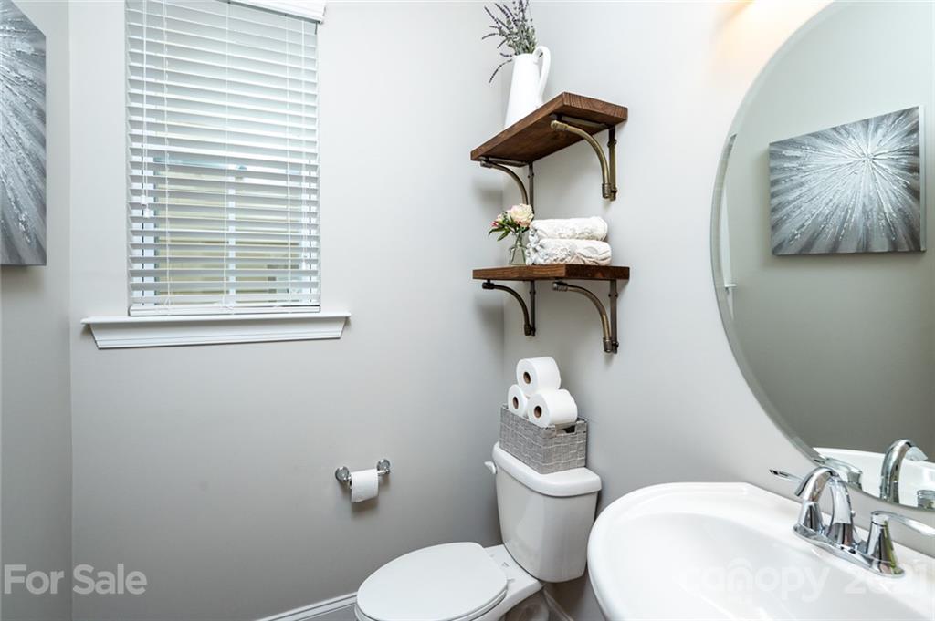 240 Helton Lane Fort Mill, SC 29708 - Photo 14 of 36 a bathroom with a toilet sink and mirror