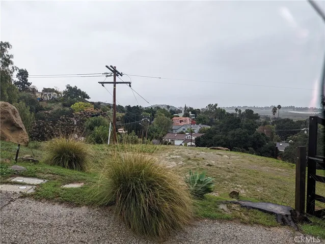 a view of a field with an ocean