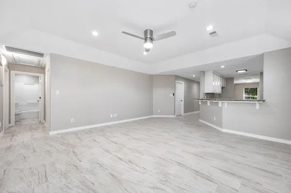 a view of a kitchen with a sink and dishwasher cabinet