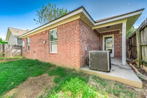 a brick building with a sign on the side of it