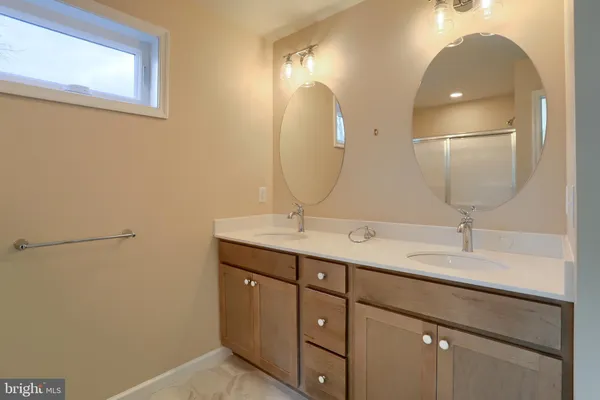 a bathroom with a glass shower door