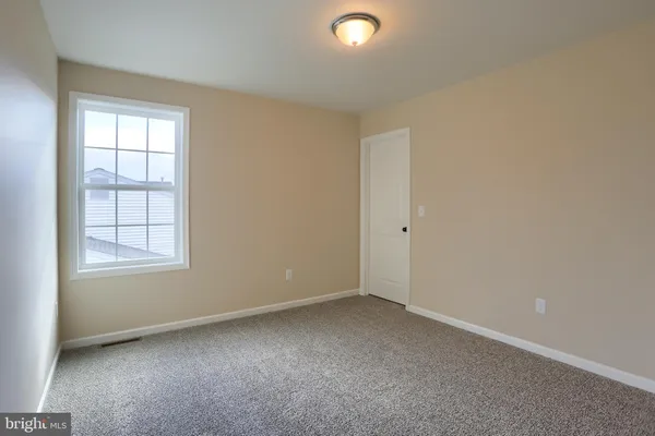 a view of balcony with wooden floor