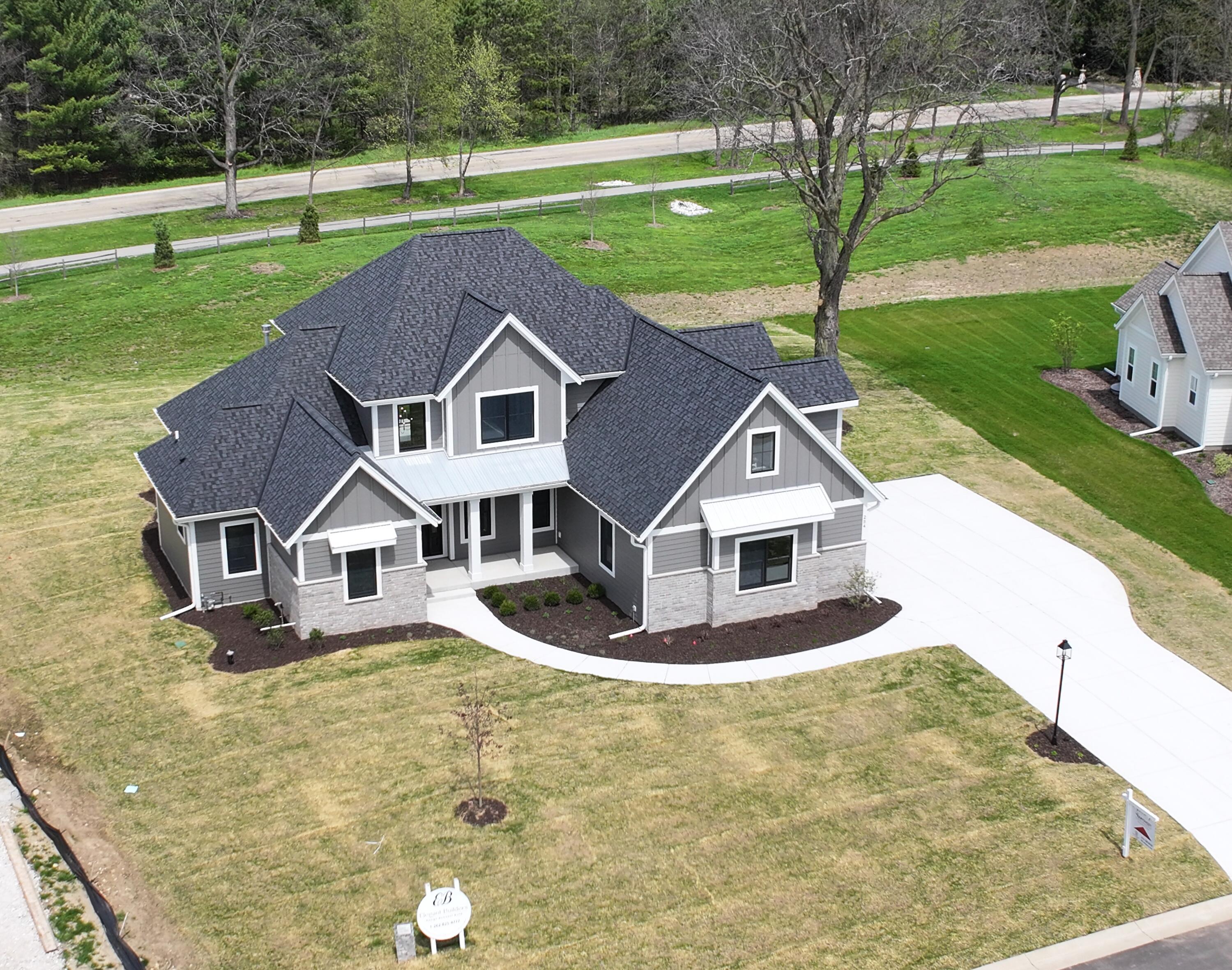 254 River Oaks Circle Delafield, WI 53018 - Photo 2 of 47 DJI_20260504101209_0027_D