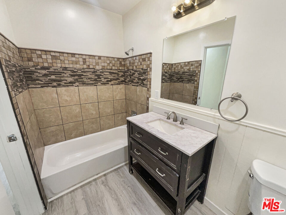 13242 Cornuta Avenue Downey, CA 90242 - Photo 12 of 19 a bathroom with a sink vanity granite and toilet