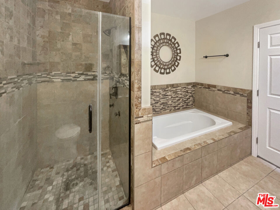 13242 Cornuta Avenue Downey, CA 90242 - Photo 14 of 19 a bathroom with a bathtub and shower