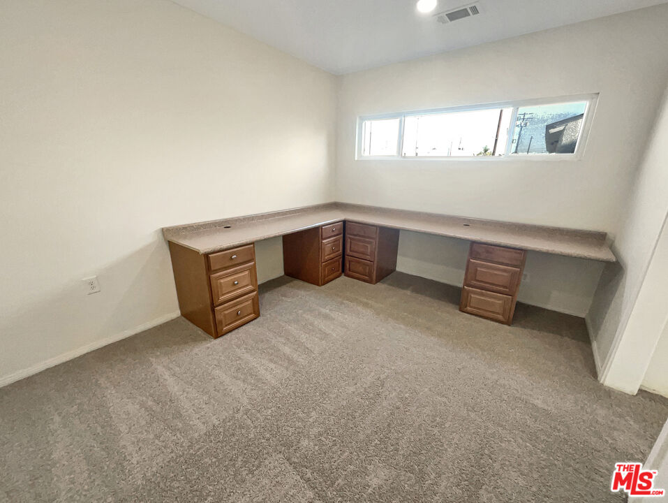 13242 Cornuta Avenue Downey, CA 90242 - Photo 15 of 19 a room with furniture and window