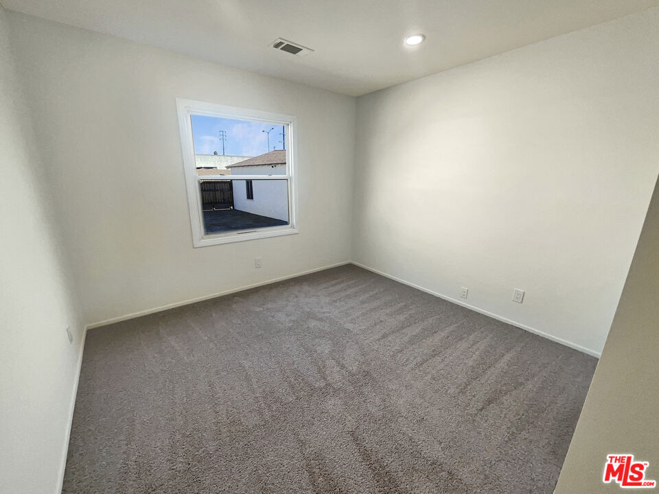 13242 Cornuta Avenue Downey, CA 90242 - Photo 17 of 19 a view of an empty room with a window