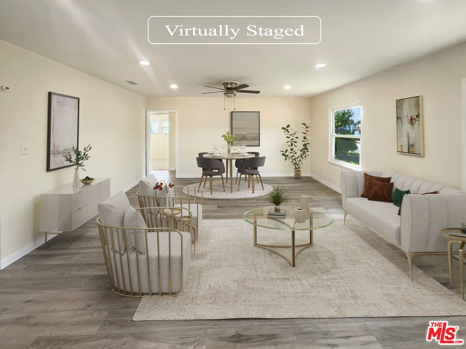 13242 Cornuta Avenue Downey, CA 90242 - Photo 2 of 19 a living room with furniture and a wooden floor