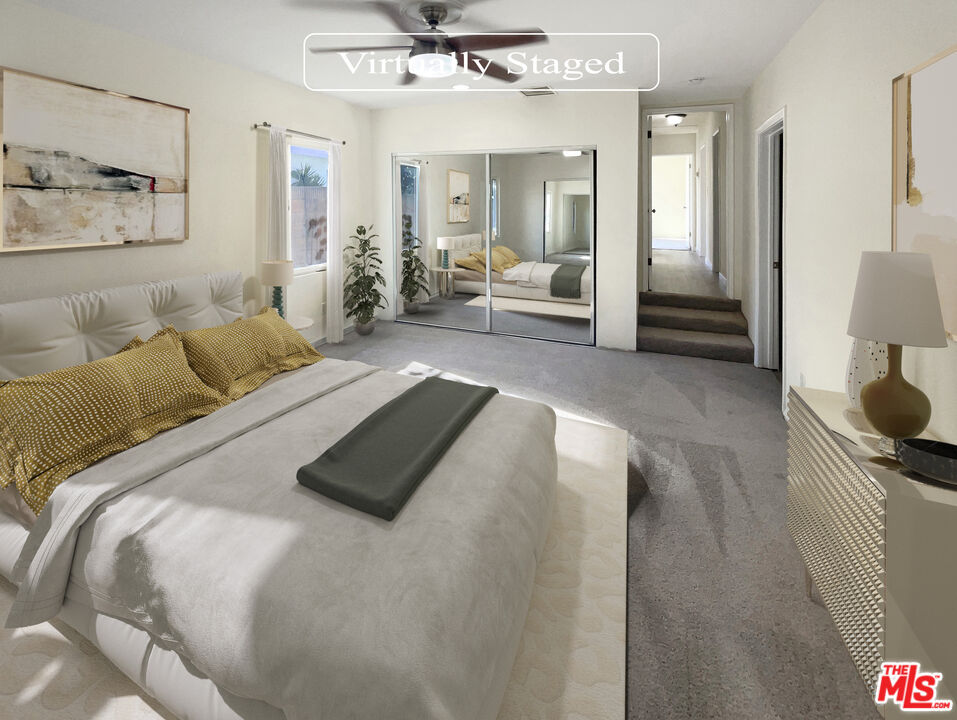 13242 Cornuta Avenue Downey, CA 90242 - Photo 4 of 19 a bedroom with a bed and couch