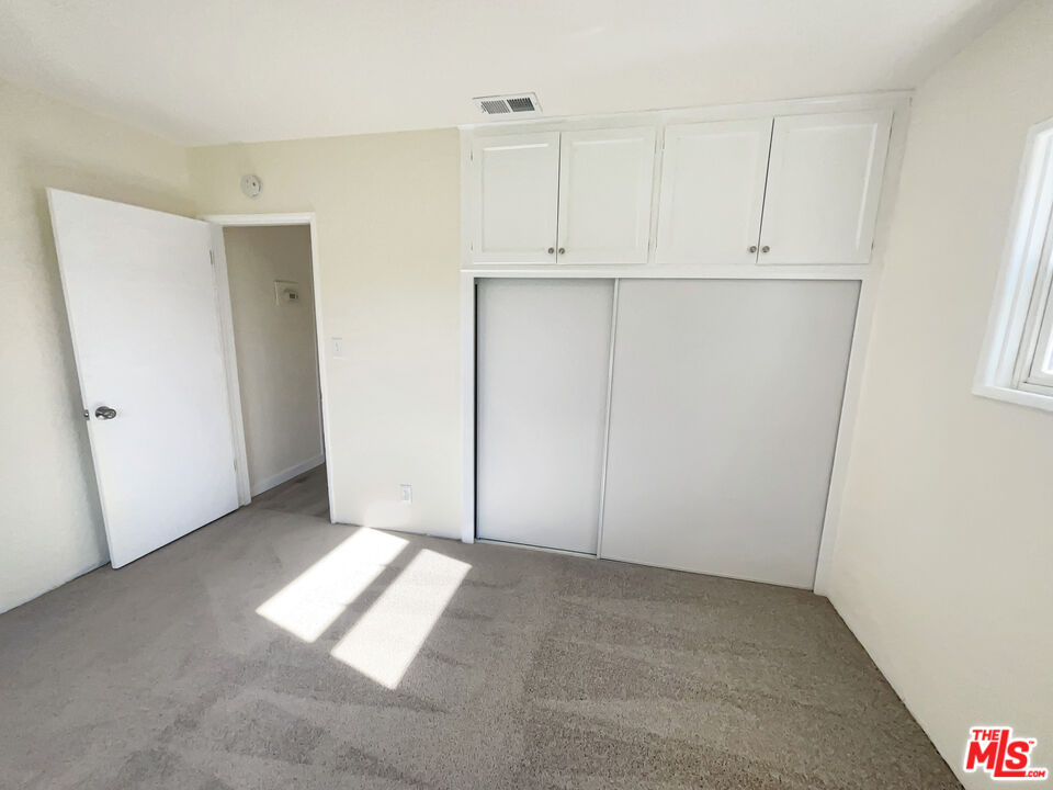 13242 Cornuta Avenue Downey, CA 90242 - Photo 10 of 19 a view of a kitchen with white cabinets