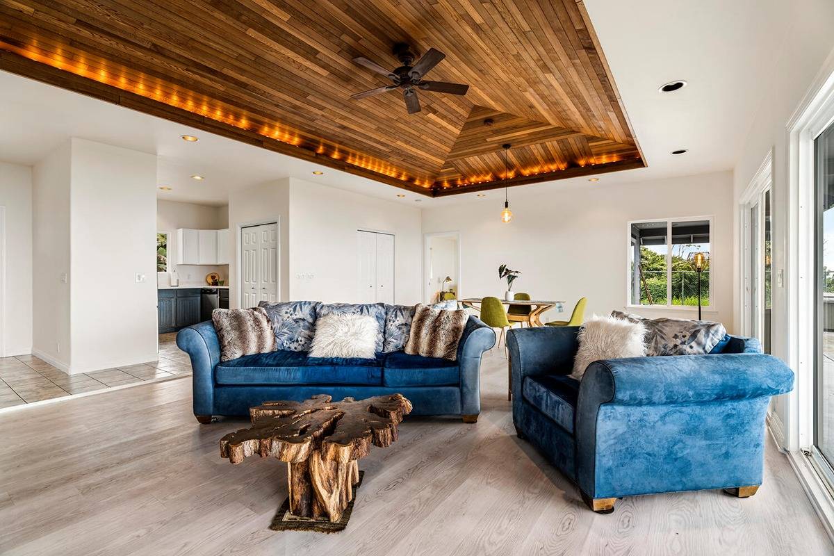 89-857 Hawaiʻi Belt Road Captain Cook, HI 96704 - Photo 15 of 30 a living room with furniture and wooden floors