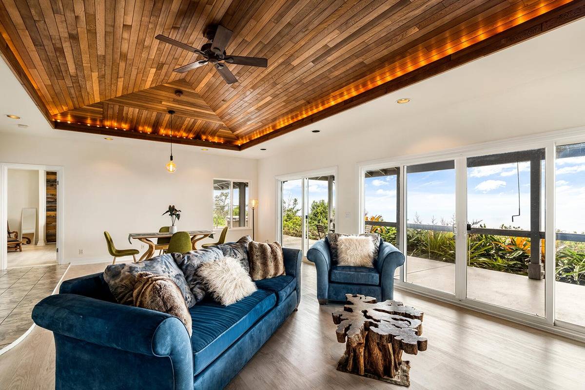 89-857 Hawaiʻi Belt Road Captain Cook, HI 96704 - Photo 16 of 30 a living room with furniture and a large window