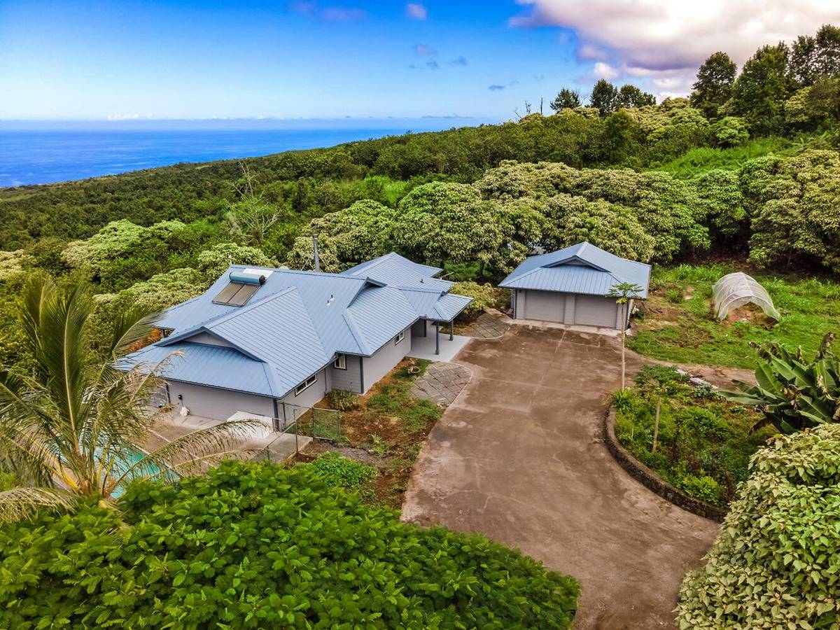 89-857 Hawaiʻi Belt Road Captain Cook, HI 96704 - Photo 26 of 30 an aerial view of a house with a yard