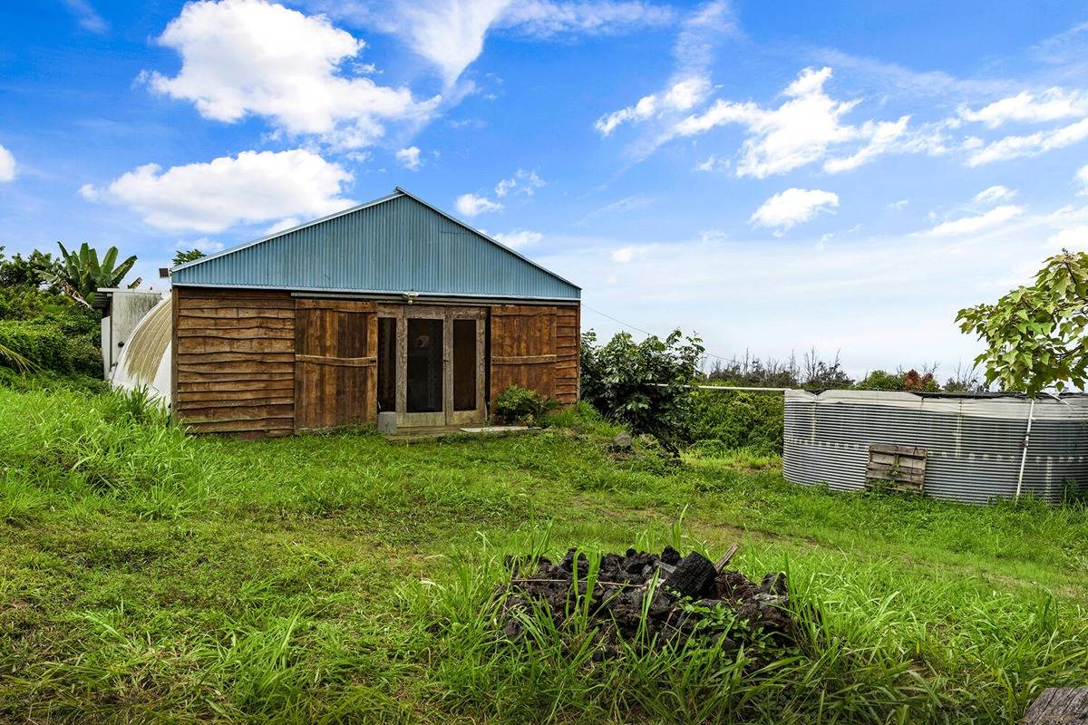 89-857 Hawaiʻi Belt Road Captain Cook, HI 96704 - Photo 27 of 30 a view of a house with a yard