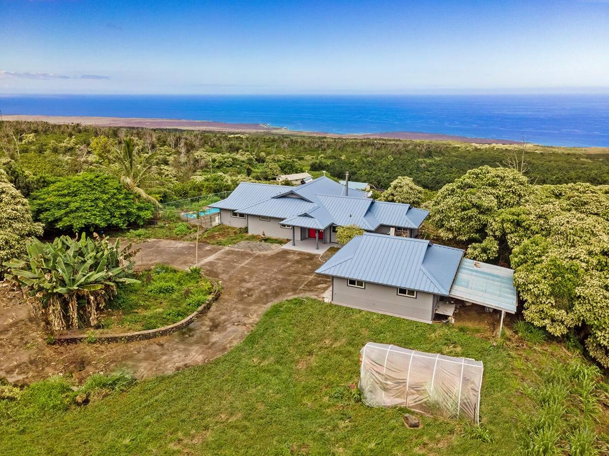 89-857 Hawaiʻi Belt Road Captain Cook, HI 96704 - Photo 8 of 30 an aerial view of residential houses with outdoor space