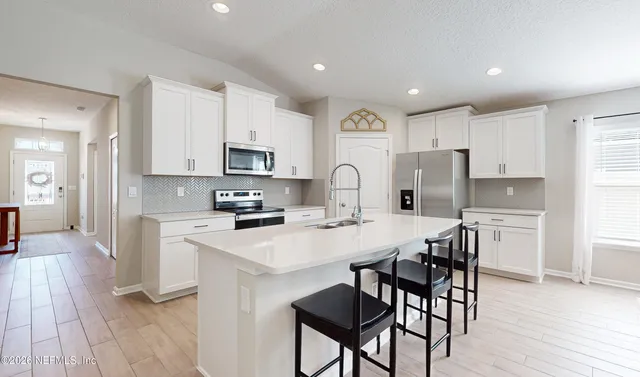 a bathroom with a shower sink double and mirror