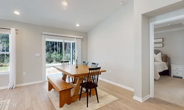 a view of a yard with a house in the background