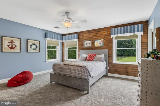 a kitchen with a refrigerator cabinets and wooden floor