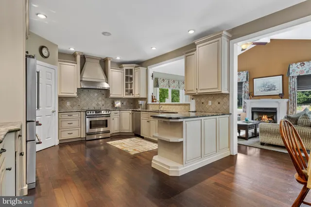 a bathroom with a sink mirror and a with a light fixture
