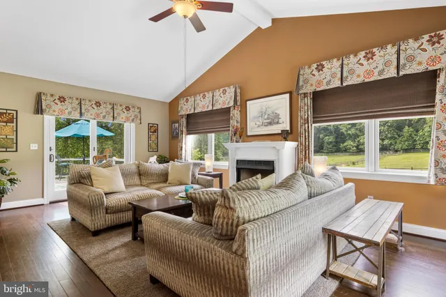 a spacious bedroom with a bed and a couch